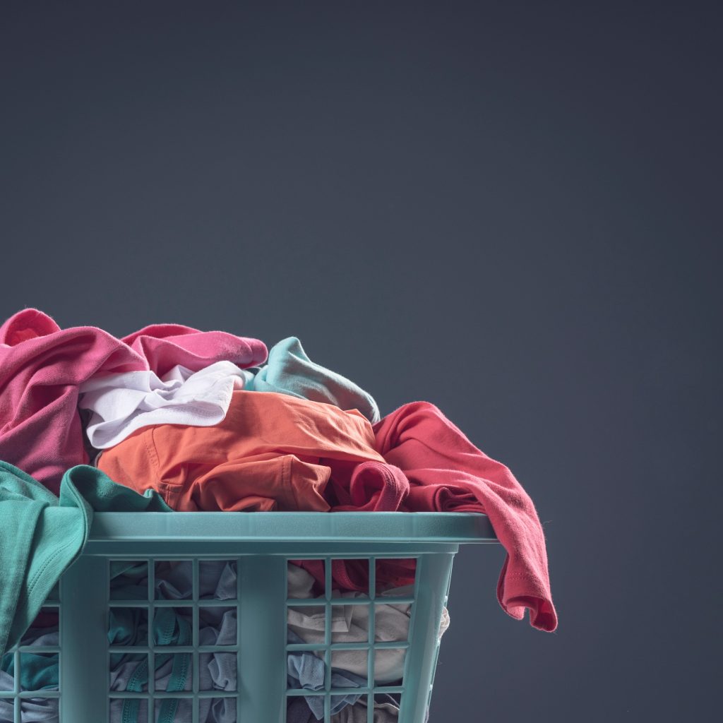 Washing basket full of clothes